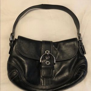 Black leather coach saddle bag